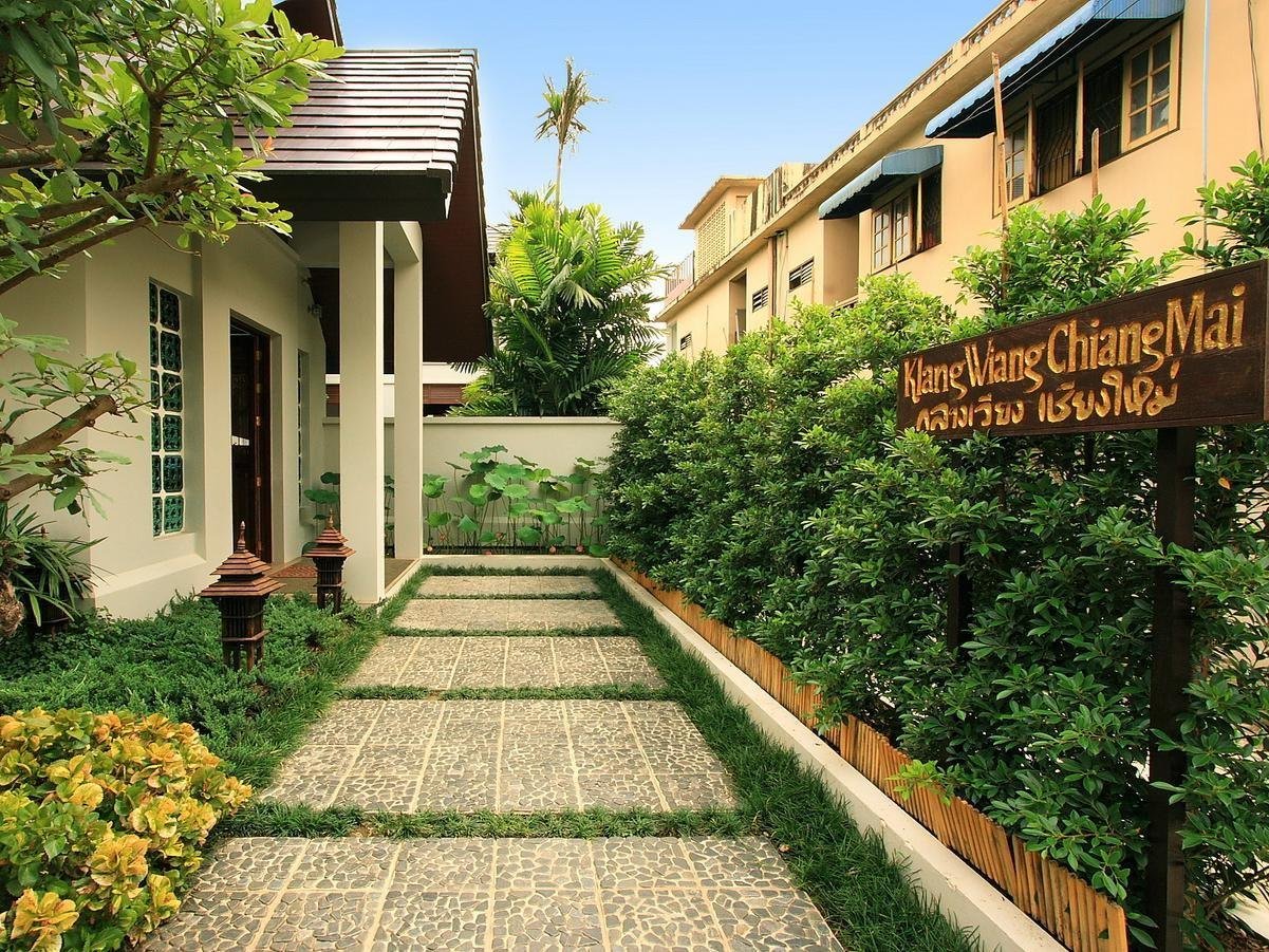 Garden path and buildings at Baan Klang Wiang Hotel
