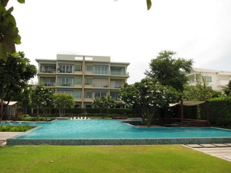 Shared pool and condominium buildings at Baan Sanpluem