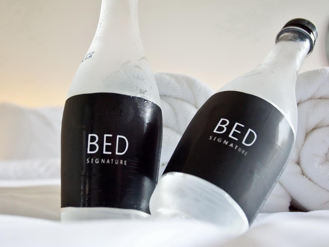 Property-branded water bottles at BED Nimman Hotel