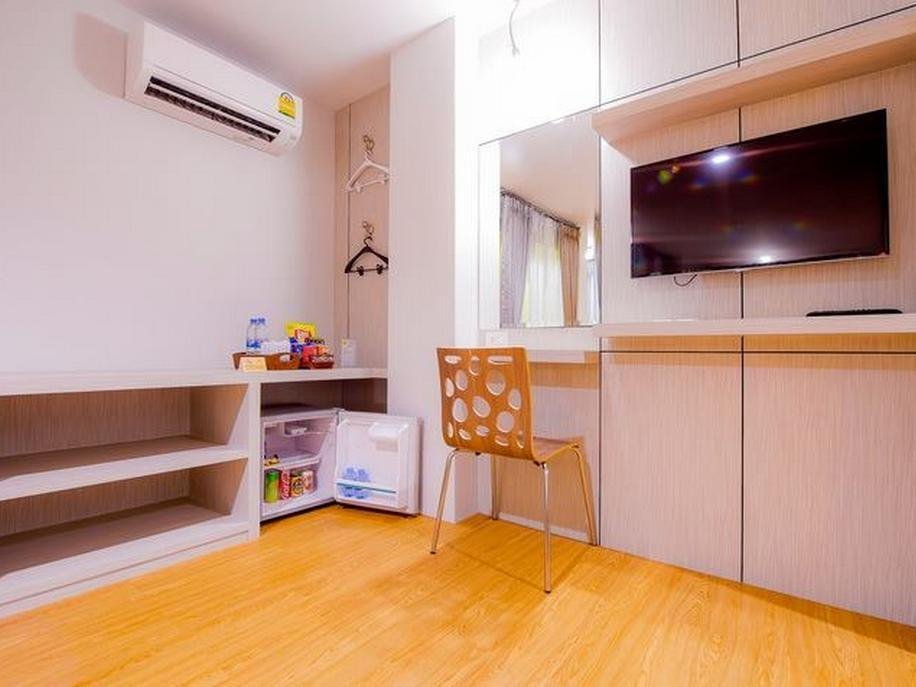 Room storage and television area at De Boutique Hotel