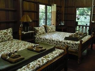 Timber bedroom interior at Khemapira Beds & Breakfast