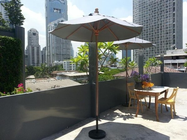 Rooftop terrace and umbrella at Le Lek Boutique Guest House