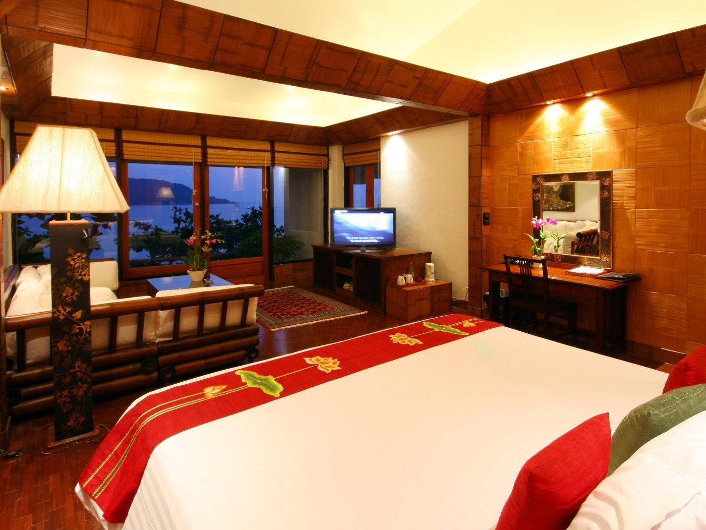 Timber-furnished guest bedroom at Mom Tri’s Villa Royale