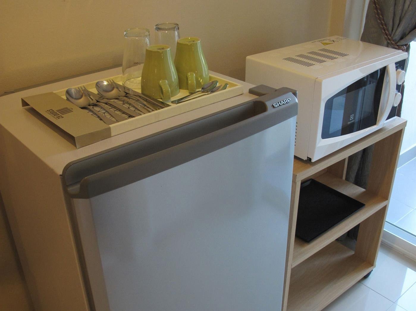 Refrigerator and microwave at Studio 62