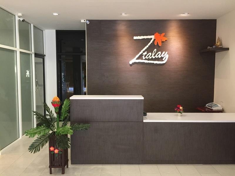 Reception desk beneath the Z-Talay sign