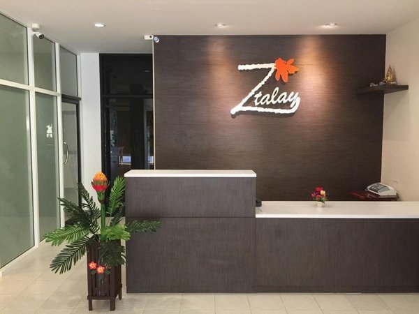 Reception desk beneath the Z-Talay sign